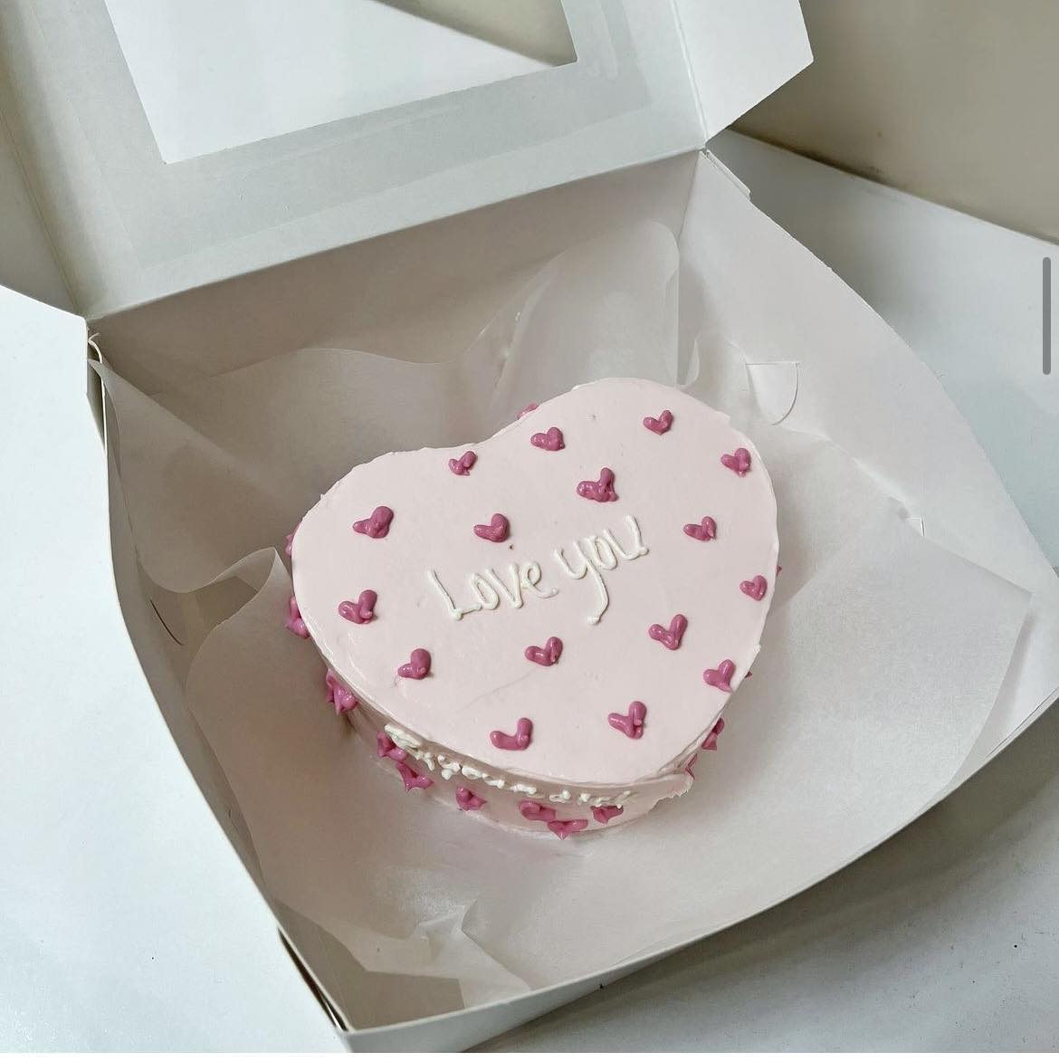 A placeholder cakes with #AF9AAE background.