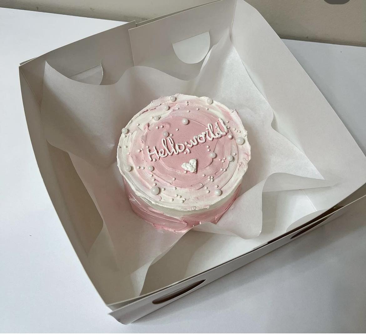 A placeholder cakes with #5D4E5A background.