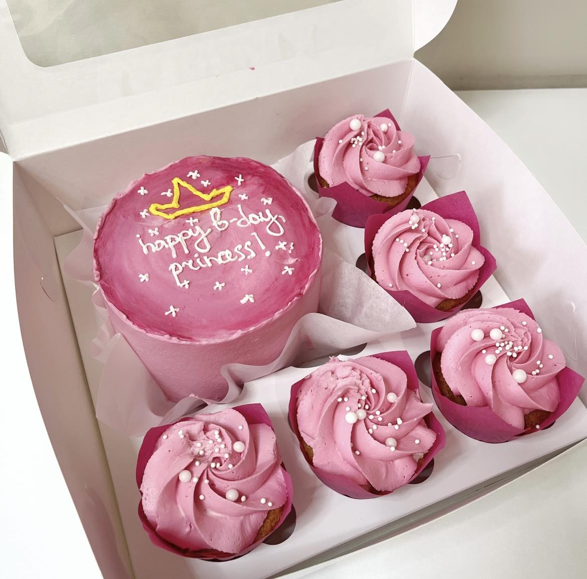 A placeholder cakes with #5D4E5A background.